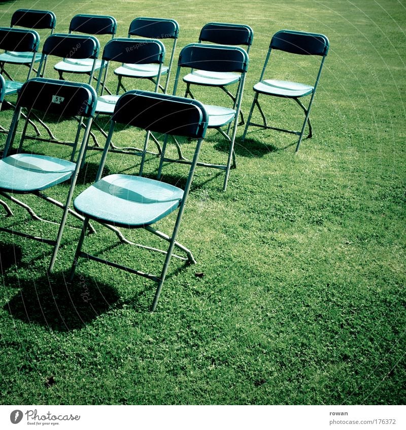 empty rows Colour photo Exterior shot Copy Space right Copy Space bottom Day Event Stage Blue Green Empty Chair Seat Audience Folding chair Presentation Shows