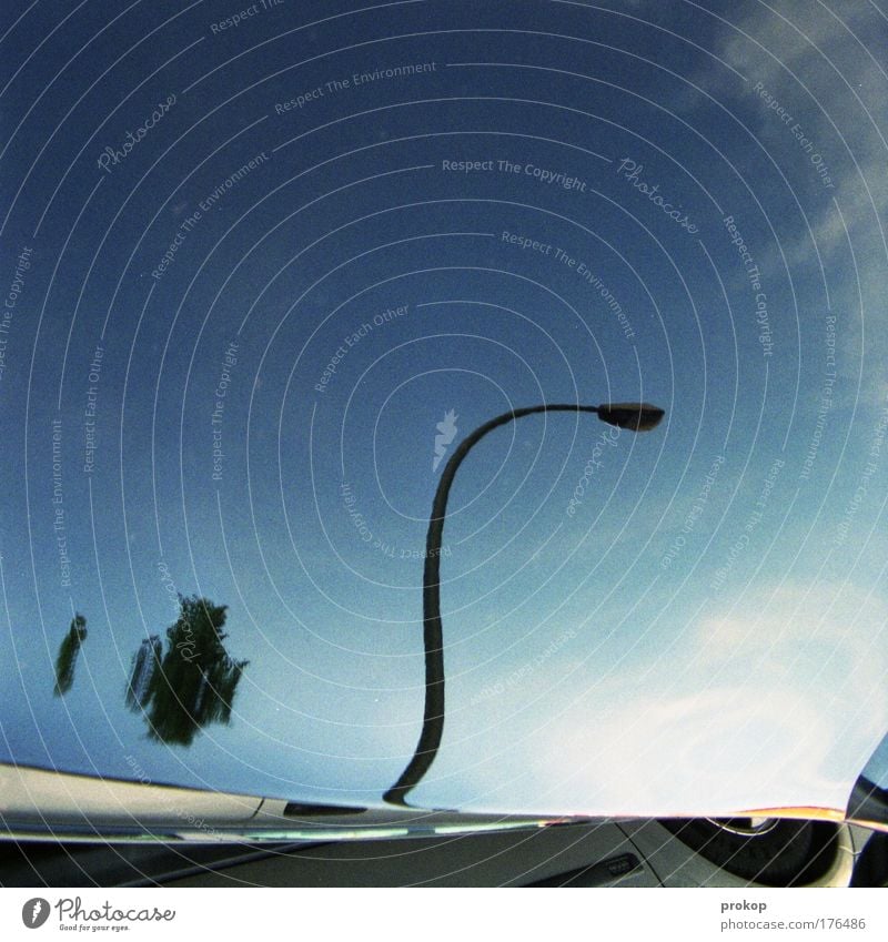 Trick Seventeen Colour photo Exterior shot Copy Space top Reflection Central perspective Street Lamp Lantern Sky Beautiful weather Car Surrealism Distorted Tire