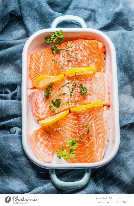 Salmon fish fillet with lemon in bowl Food Fish Herbs and spices Cooking oil Nutrition Lunch Banquet Organic produce Vegetarian diet Diet Bowl Style