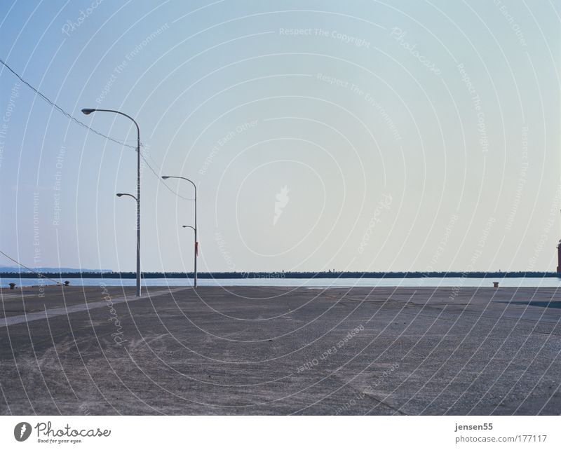 onshore Colour photo Exterior shot Deserted Day Long shot Harbour Parking lot Wait Esthetic Arrangement Perspective Calm Lamp Lamp post Lantern Gravel Horizon