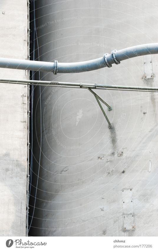 tubes Colour photo Subdued colour Exterior shot Detail Deserted Day Industry Industrial plant Silo Concrete Metal Tall Gloomy Transmission lines Pipe Cross