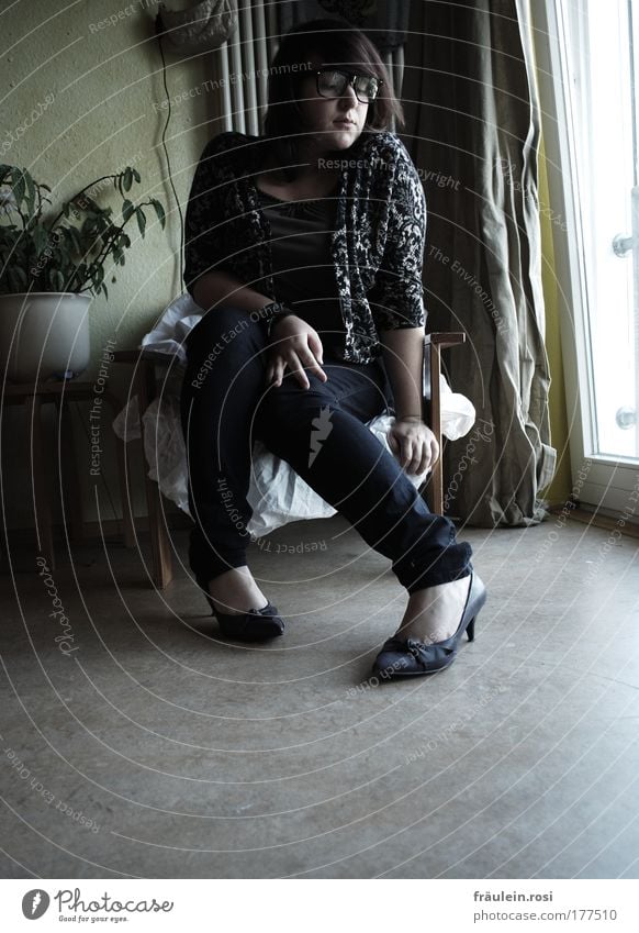 In my sister's shoes. Interior shot Day Shadow Contrast Central perspective Full-length Front view Downward Looking away Armchair Room Human being Feminine