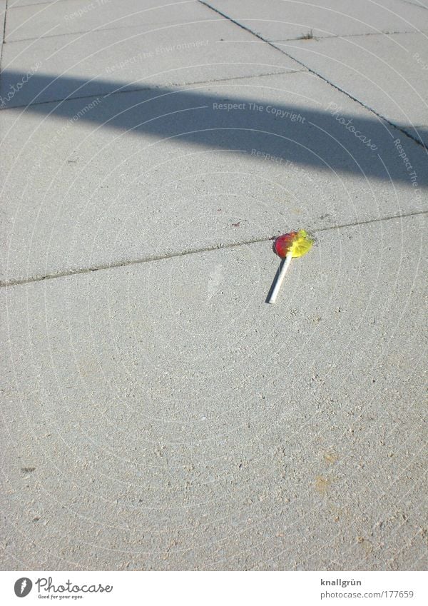 Sucked to death Colour photo Exterior shot Deserted Copy Space left Copy Space top Copy Space bottom Neutral Background Shadow Sunlight Food Candy Lollipop