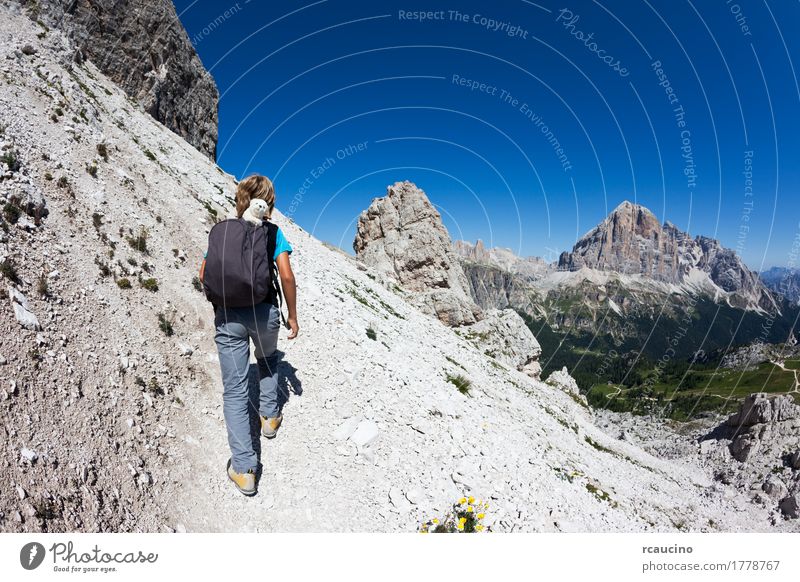 Young hiker walking on a mountain trail. Dolomities, Italy Joy Vacation & Travel Tourism Adventure Summer Mountain Sports Child Boy (child) Man Adults Nature