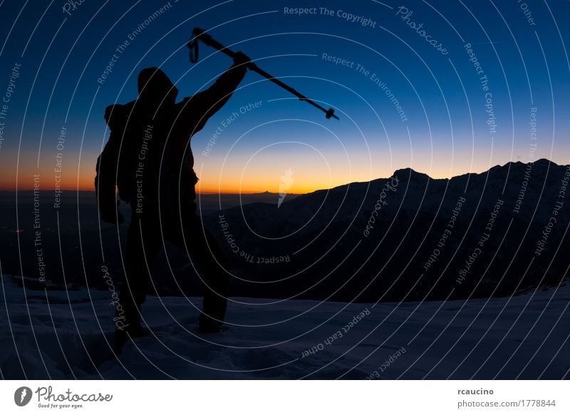 At sunset a man stands on a snowy peak expressing his joy Joy Beautiful Vacation & Travel Trip Adventure Expedition Sun Winter Snow Mountain Hiking Sports