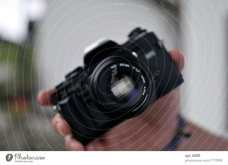 X-700 Colour photo Exterior shot Close-up Day Shadow Shallow depth of field Camera Technology Human being Masculine Arm Hand 1 Authentic Exceptional Black Power