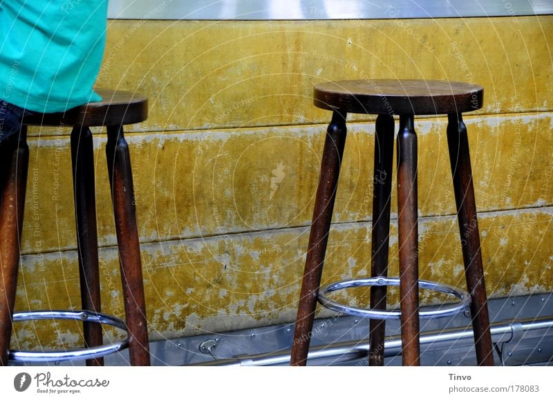 2 bar stools of which only one is occupied Night life Event Bear Cocktail bar Going out Brown Leisure and hobbies Society Stool Roadhouse Counter Date Places