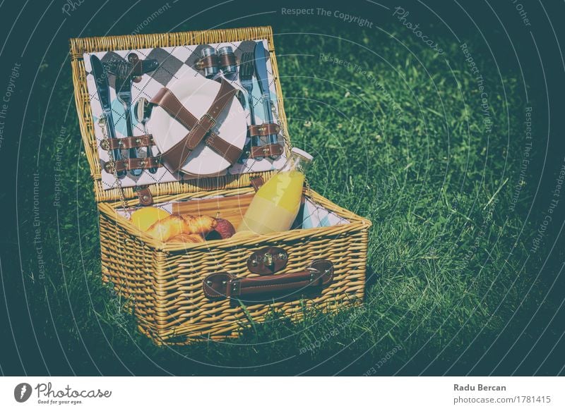 Picnic Basket With Orange Juice, Apples, Oranges And Croissants Fruit Nutrition Eating Breakfast Lunch Organic produce Plate Bottle Cutlery Knives Fork Spoon