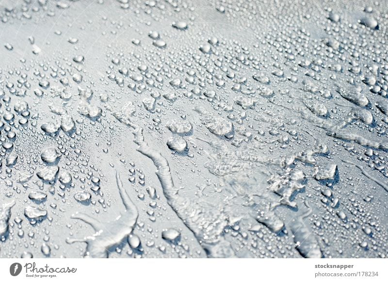 Water on a car Wet Car Silver Metal Sprayed Drop