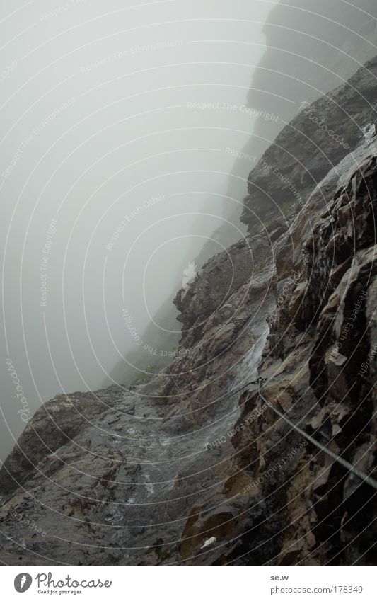 Path into (the un-?)Certain Sates Colour photo Exterior shot Deserted Copy Space left Copy Space top Contrast Wide angle Mountain Landscape Elements Bad weather