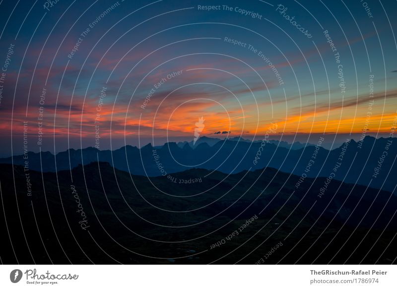 mood Environment Nature Landscape Blue Multicoloured Yellow Orange Red Black Sky Dusk Mountain Alps Switzerland Clouds Sunset Colour photo Exterior shot