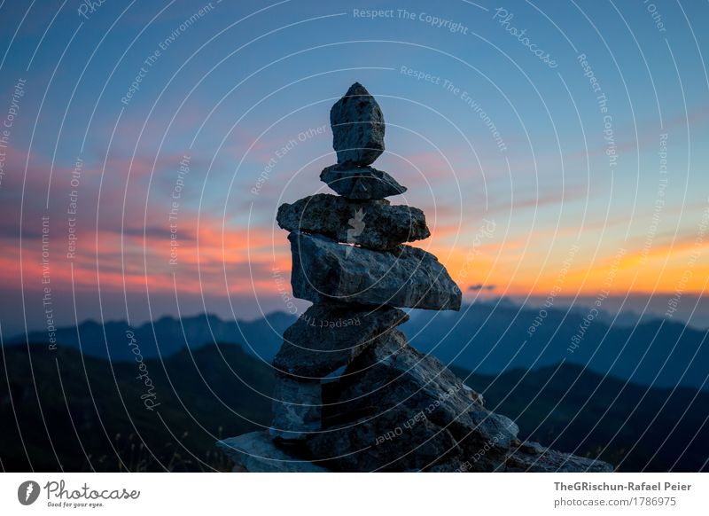 cairn Environment Nature Landscape Blue Gray Orange Pink Black Stone Cairn Sky Moody Dawn Mountain Mountain range Heap Colour photo Exterior shot Deserted