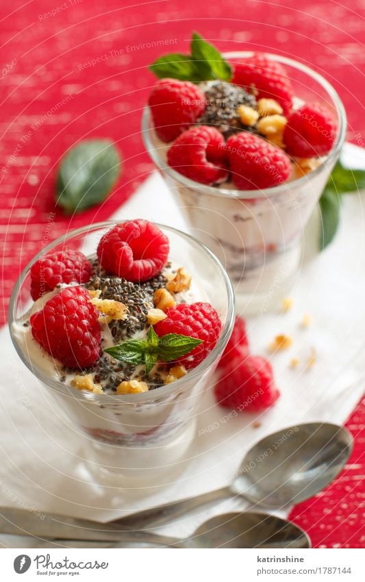 Breakfast with Yogurt and raspberries Yoghurt Fruit Dessert Nutrition Vegetarian diet Diet Spoon Wood Fresh Delicious Green White Berries cream Dairy food