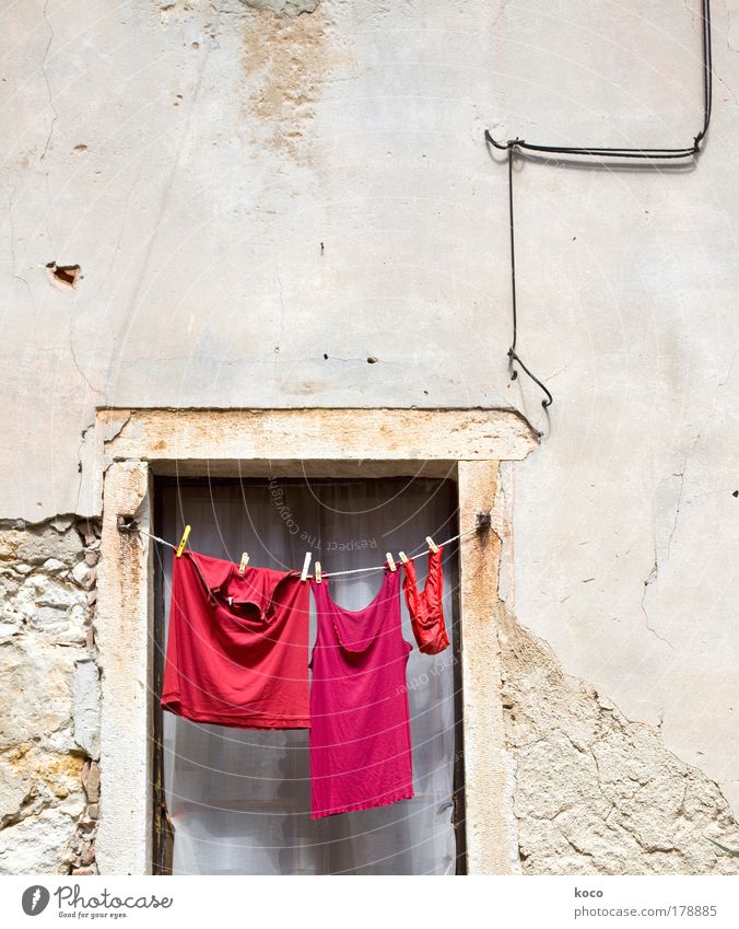 red.red.red! Colour photo Exterior shot Deserted Copy Space top Day Deep depth of field Long shot Summer Old town Window Clothing T-shirt Underwear Hang Red