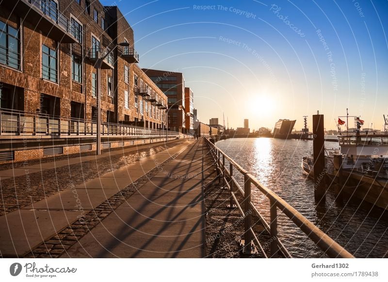 Port of Hamburg and Dockland in the backlight of the morning sun Tourism House (Residential Structure) River bank Capital city Port City Harbour Architecture