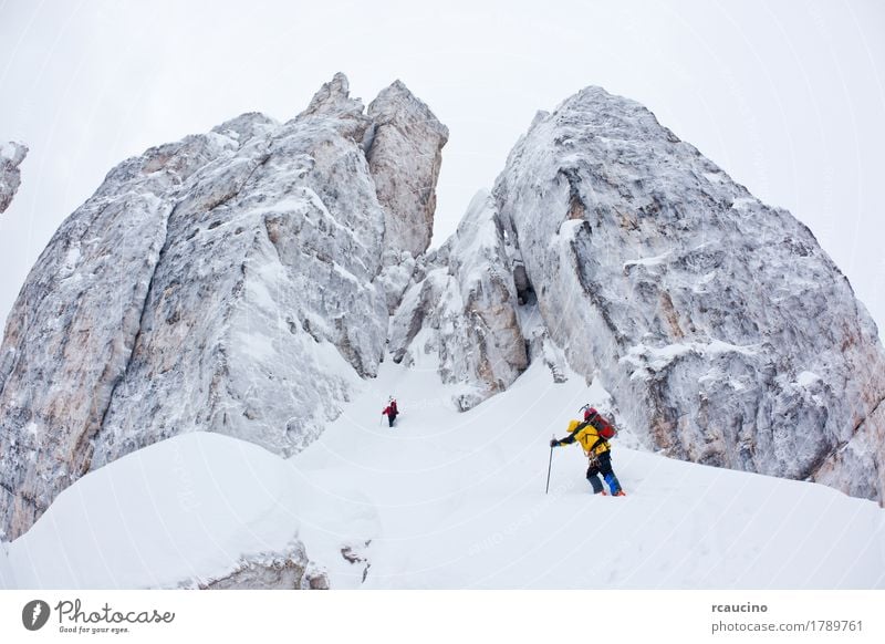 Two climbers next to the Cinque Torri, Dolomiti, Italy. Adventure Expedition Winter Snow Mountain Sports Climbing Mountaineering Nature Landscape Peak Glacier