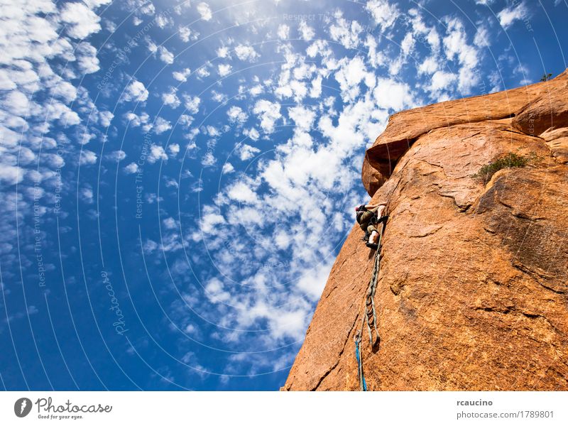 climber on a steep granitic cliff, Morocco, Africa. Vacation & Travel Adventure Expedition Mountain Climbing Mountaineering Rope Man Adults Landscape Clouds