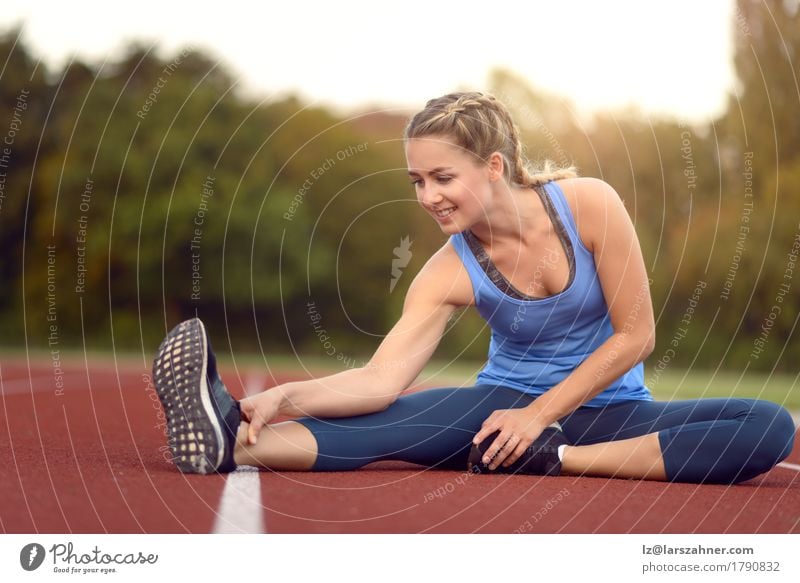 Happy fit young woman doing stretching exercises Lifestyle Beautiful Face Summer Sports Feminine Woman Adults 1 Human being 18 - 30 years Youth (Young adults)