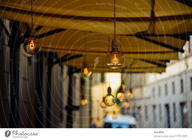 street café Town Port City Old town Pedestrian precinct Illuminate Electric bulb Suspended Lighting Moody Lamp Lamplight Sidewalk café Café Restaurant Summer