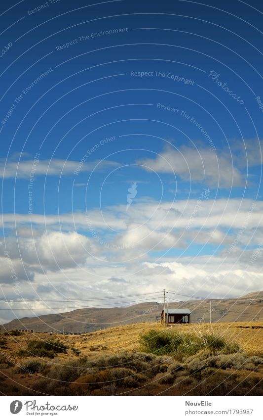 On the road in Argentina El Calafate Pampa Desert Hut Clouds power line