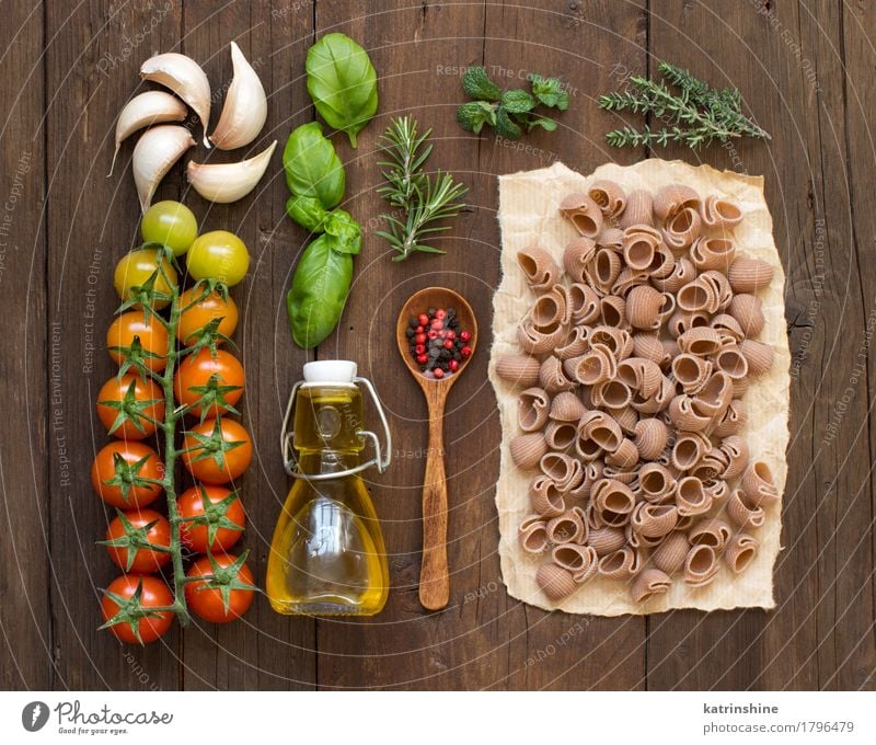 Whole spelt pasta, vegetables, herbs and olive oil Vegetable Dough Baked goods Herbs and spices Cooking oil Vegetarian diet Diet Bottle Spoon Dark Fresh Brown