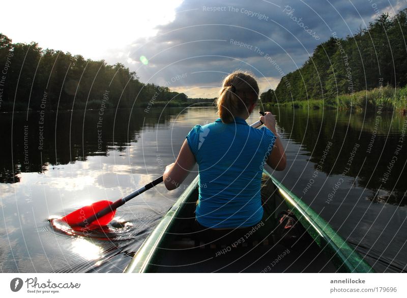 The lake rests still Leisure and hobbies Canoeing Tourism Trip Adventure Expedition Aquatics Young woman Youth (Young adults) Woman Adults Back 18 - 30 years