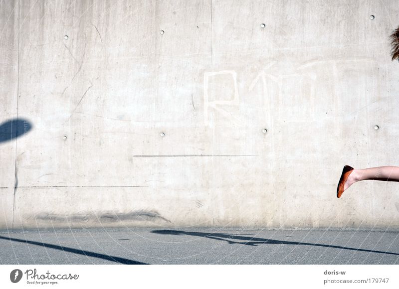 orange shoe Sunlight Joy Hair and hairstyles Summer Jogging Feminine Woman Adults Feet Footwear Red-haired Walking Jump Orange Gray Legs Wall (building)