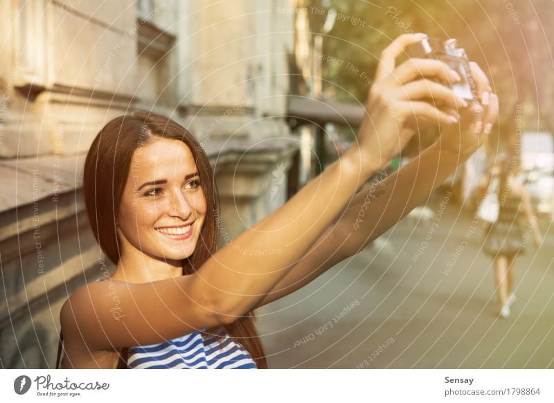 Pretty girl taking selfie on street Joy Happy Beautiful Face Vacation & Travel Summer Sun Camera Human being Girl Woman Adults Hand Autumn Street Fashion Hair