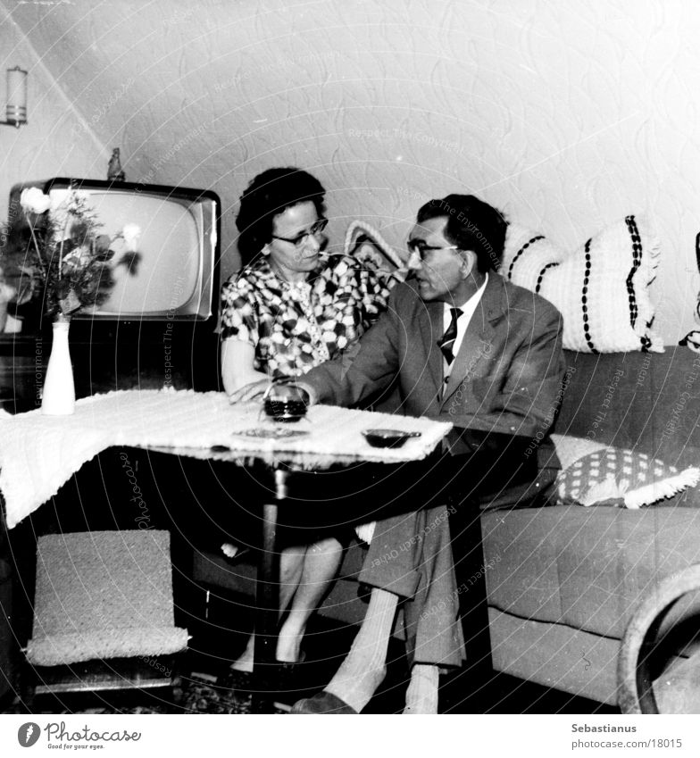 TV - with man and woman Man Woman TV set Living room Sixties Sofa Black & white photo