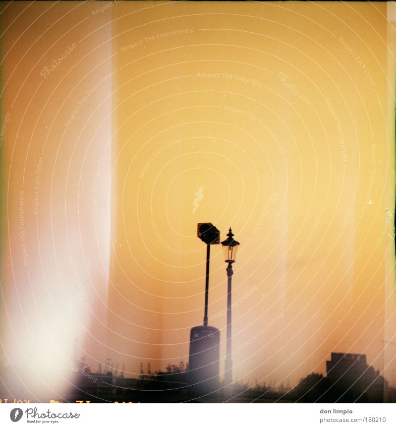 slide melting Colour photo Exterior shot Evening Silhouette Sunrise Sunset Back-light Shallow depth of field Worm's-eye view Summer Cloudless sky Horizon