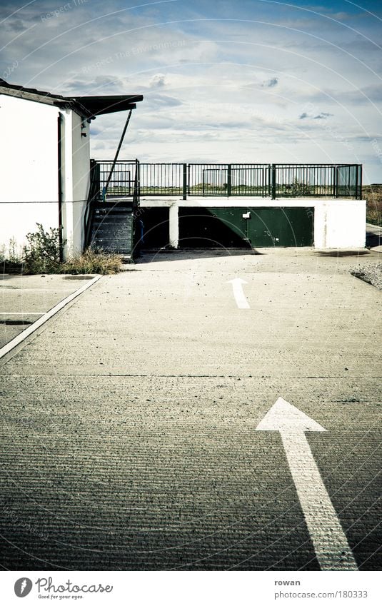 straight ahead Colour photo Exterior shot Day Transport Road traffic Motoring Street Lanes & trails Road sign Vehicle Gray Arrow Clue Direction Parking Garage