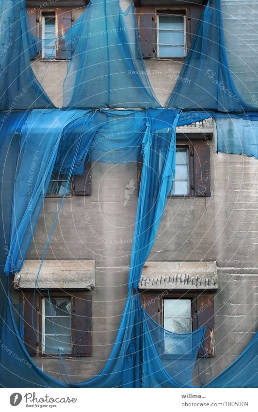 Fatal. Torn blue scaffolding net at old factory Construction site scaffold net scaffold tarpaulin Factory Manmade structures Building Architecture