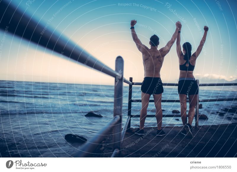 Fitness Couple doing conquering pose after Run at the beach Lifestyle Happy Beach Ocean Sports Human being Partner 2 18 - 30 years Youth (Young adults) Adults