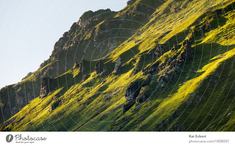 Mountain crag in the evening sun Nature Landscape Sunrise Sunset Summer Beautiful weather Grass Rock Alps Discover Hiking Esthetic Sharp-edged Wild Green Power