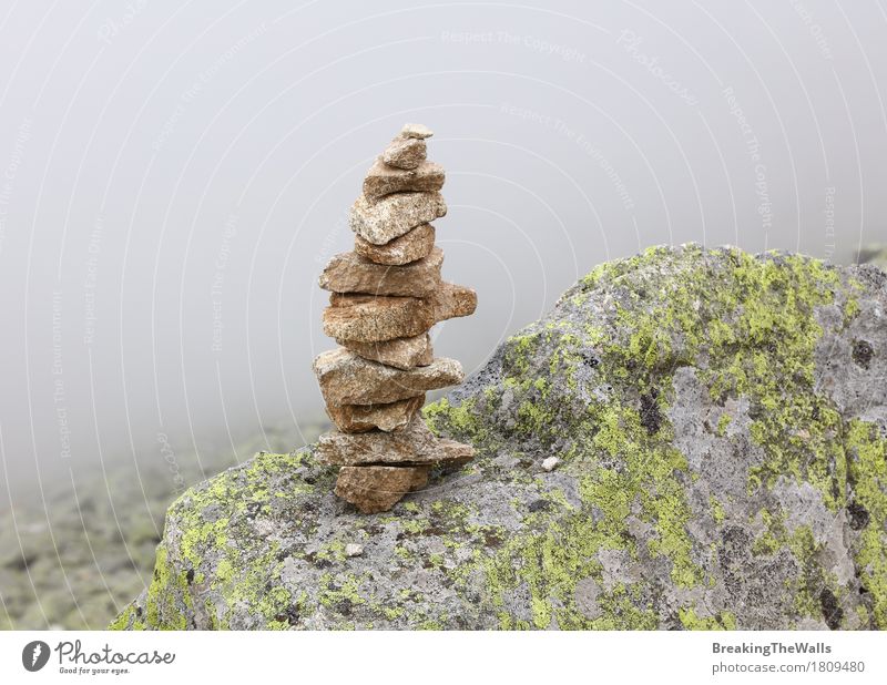 Pyramid of rocks and stones in mountains over fog Vacation & Travel Tourism Trip Adventure Expedition Mountain Hiking Nature Landscape Elements Earth Air Clouds