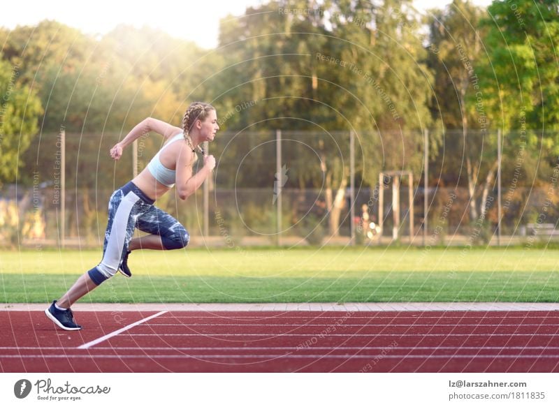 Female athlete training for a race Happy Face Sports Racecourse Woman Adults 1 Human being 18 - 30 years Youth (Young adults) Blonde Fitness Smiling Power