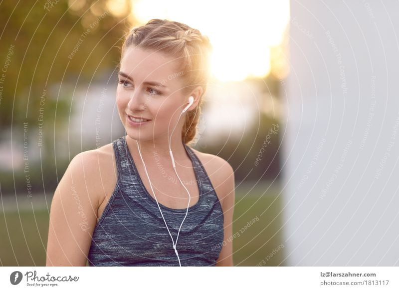 Attractive young woman with earphones listening to music Lifestyle Happy Beautiful Face Summer Music Woman Adults 1 Human being 18 - 30 years