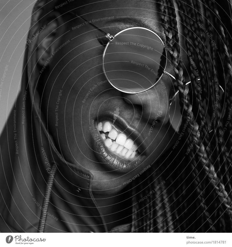 Universal wisdom Feminine Mouth Teeth 1 Human being Coat Rain jacket Sunglasses Black-haired Long-haired Dreadlocks Smiling Aggression Threat Brash Rebellious