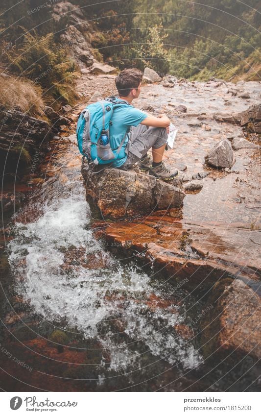 Boy sitting on a rock on mountain trail Lifestyle Leisure and hobbies Vacation & Travel Trip Adventure Freedom Summer Summer vacation Mountain Hiking