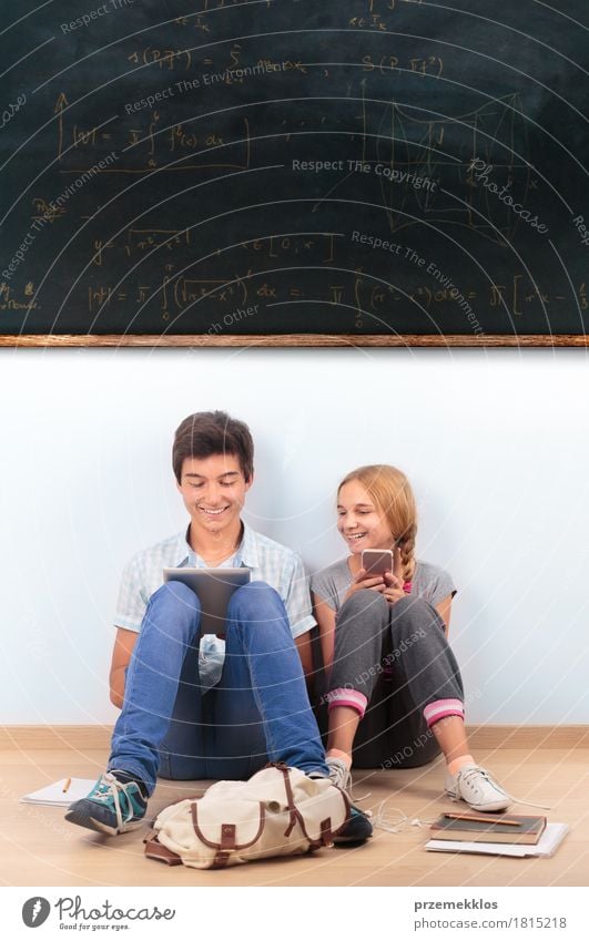 Teenagers learning by a blackboard at school Education School Classroom Blackboard Schoolchild Student Academic studies Study University & College student