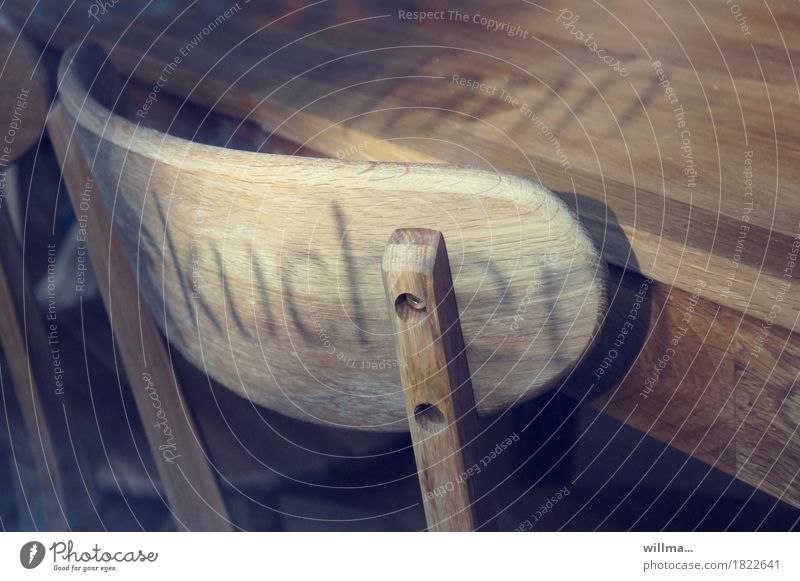 Wooden chair, wooden table and shadow of the word cake Chair Table Cake Pancake Shadow play Characters Text Word Wooden table Light and shadow Backrest