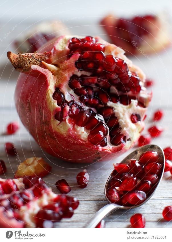 Open fresh ripe pomegranates Fruit Nutrition Vegetarian diet Diet Spoon Exotic Wood Fresh Delicious Juicy Brown Red agriculture antioxidant food Garnet healthy