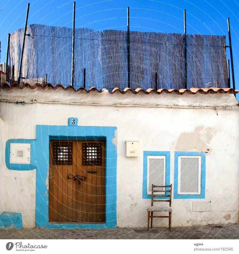 Lonely chair Colour photo Exterior shot Deserted Day Long shot Beautiful weather Hut Door Living or residing Bright Blue White Moody Safety Romance Life