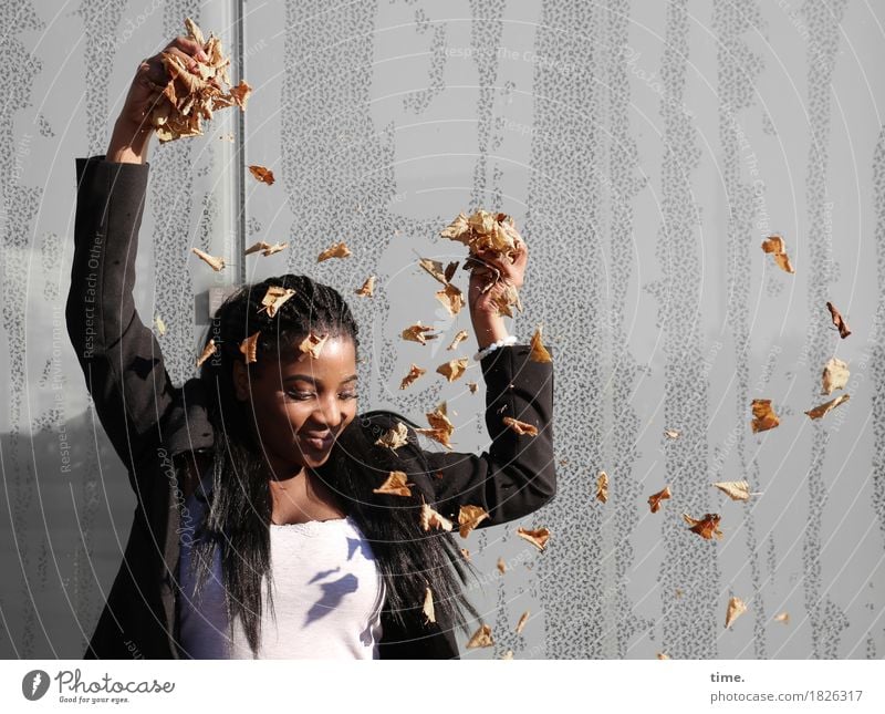 . Feminine 1 Human being Autumn Beautiful weather Leaf Wall (barrier) Wall (building) T-shirt Jacket Black-haired Long-haired Dreadlocks Observe To hold on