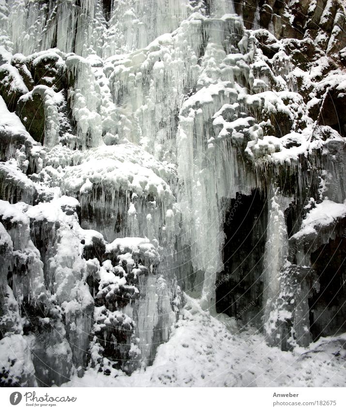 Icefall with snow and icicles Black & white photo Subdued colour Exterior shot Detail Deserted Evening Light Shadow Contrast Silhouette Environment Nature