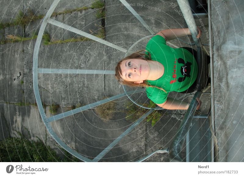 captive Green Woman T-shirt Hair and hairstyles Above Bird's-eye view Looking To hold on Young woman 18 - 30 years Face of a woman Upper body Upward Fire ladder