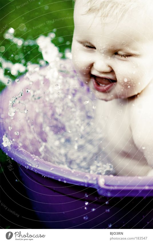 Water's coming off! Colour photo Exterior shot Close-up Detail Day High-key Blur Shallow depth of field Portrait photograph Upper body Front view Looking away