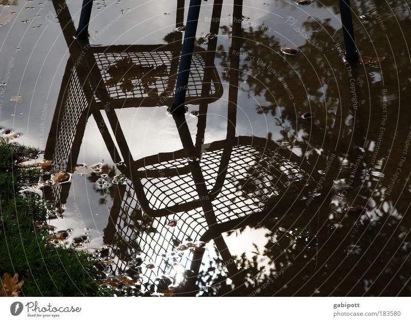 Between the stools... Subdued colour Exterior shot Deserted Day Reflection Leisure and hobbies Chair Water Clouds Storm clouds Weather Bad weather Rain Park