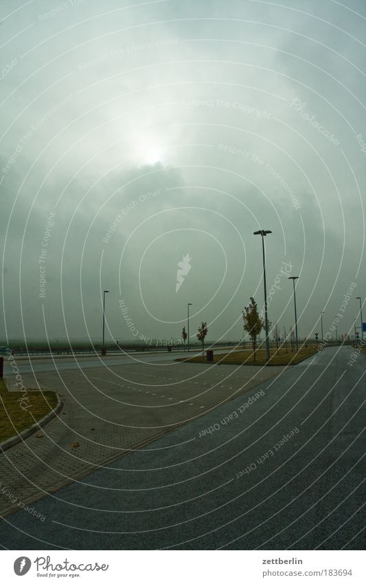 parking space Autumn Mecklenburg November pre-Pomerania Parking lot Highway Clouds Cloud cover Fog Sunrise intaglio Lantern Traffic lane Gloomy Copy Space