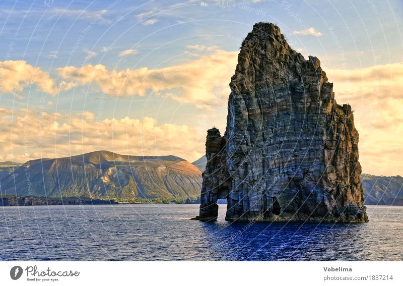 Rock near Lipari Environment Nature Landscape Elements Water Clouds Volcano Coast Ocean Mediterranean sea Blue Brown Yellow Gold Gray Colour photo Exterior shot